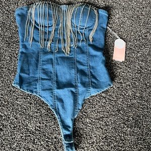 Denim bodysuit with rhinestone fringe.  Size L.  Brand new with tag.